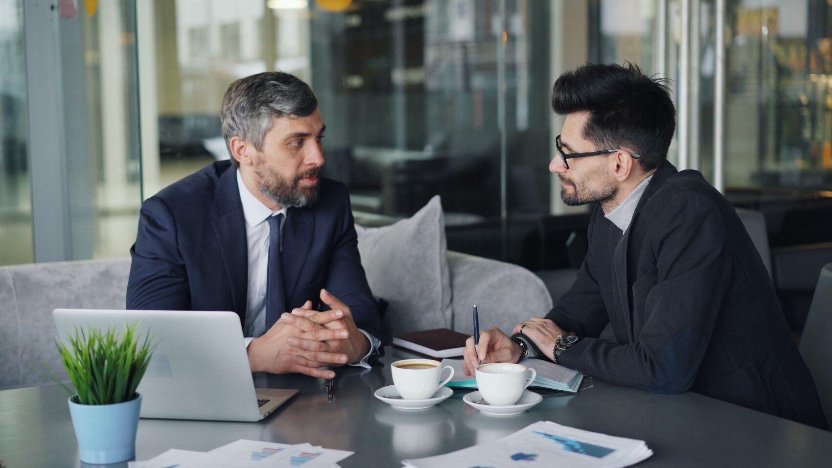 Two professionals in a one-to-one management conversation